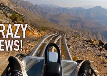 "Kotor Coaster cart speeding down the track with Kotor Bay in the background"