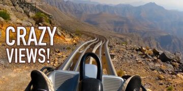 "Kotor Coaster cart speeding down the track with Kotor Bay in the background"