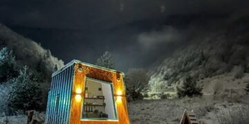 Cozy interior of Tiny Glamp House - Danguba with a comfortable bed and warm lighting.