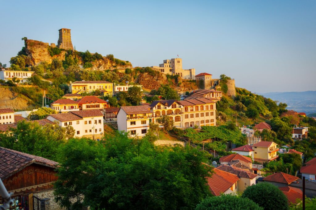 Berat, Albania — Charming view of Krujë Castle and old town in Albania with colorful houses at sunset.