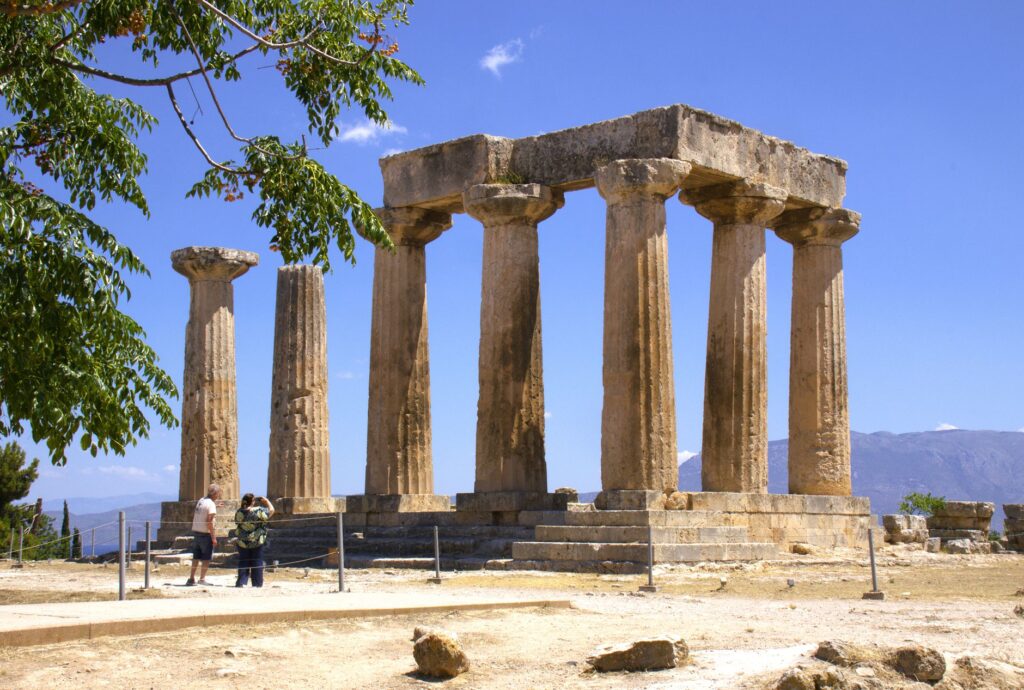 Corinth, Greece — Explore the Ancient Corinth Temple, showcasing classic Greek architecture under a clear summer sky.