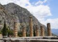 Delphi, Greece — Capture of ancient temple columns at Delphi, Greece, under a bright sky.
