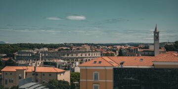 Istria, Croatia — A picturesque aerial view of Pula, Croatia, featuring the historic Roman amphitheater.