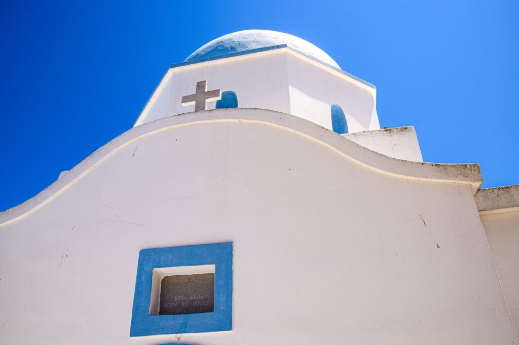 Laganas, Greece — Close-up of a traditional white and blue Greek Orthodox church on a sunny day.