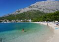 Makarska, Croatia — Baška Voda beach in Croatia, offering clear waters, scenic mountains, and a relaxing summer vibe.