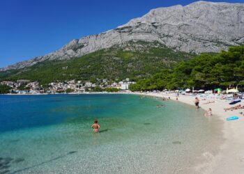 Makarska, Croatia — Baška Voda beach in Croatia, offering clear waters, scenic mountains, and a relaxing summer vibe.