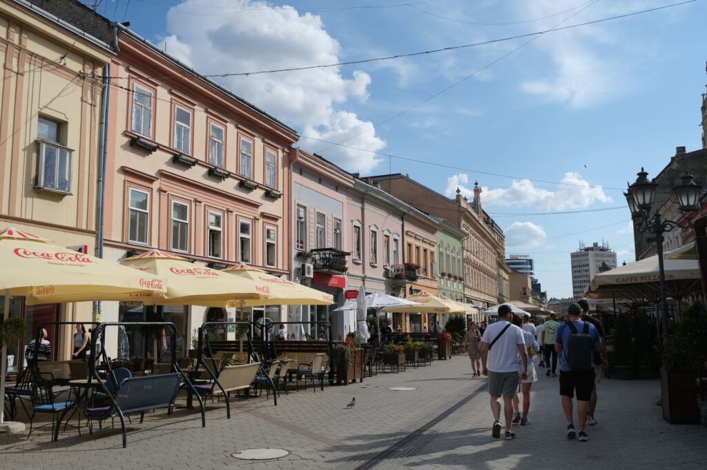 Novi Sad, Serbia — Street view of Novi Sad, Serbia with people enjoying outdoor cafes.