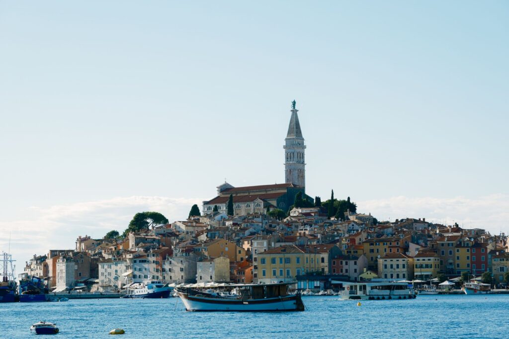 Rovinj, Croatia — Captivating view of Rovinj's colorful buildings and iconic bell tower along the Adriatic Sea.