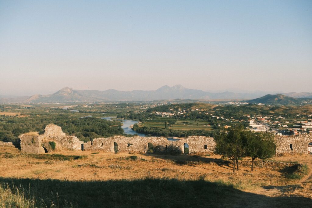 Shkoder, Albania — A panoramic view of the Albanian landscape and Shkodër Castle ruins from Rozafa Castle during a summer day.