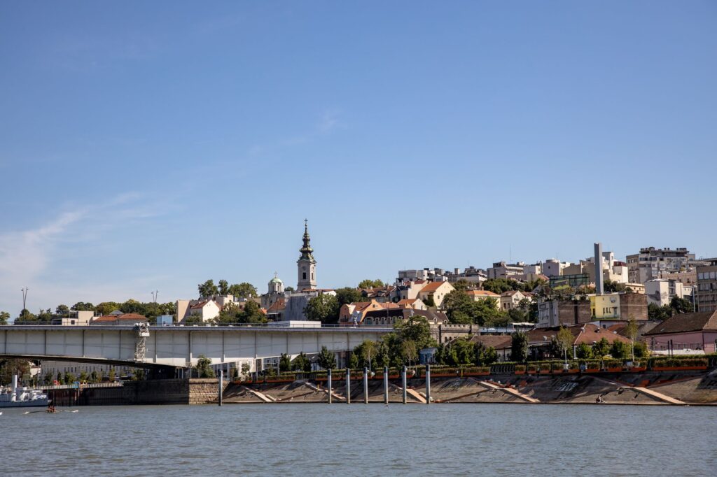 Belgrade, Serbia — Panoramic view of Belgrade with a bridge, cityscape, and St. Michael's Cathedral.