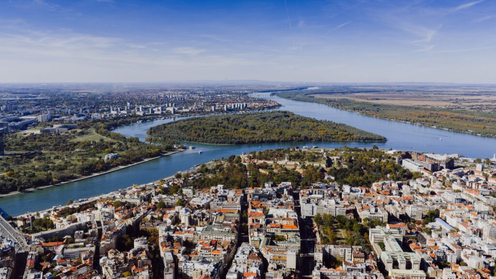 Belgrade, Serbia — Aerial view showcasing the cityscape of Belgrade, Serbia with the Danube River winding through the landscape.