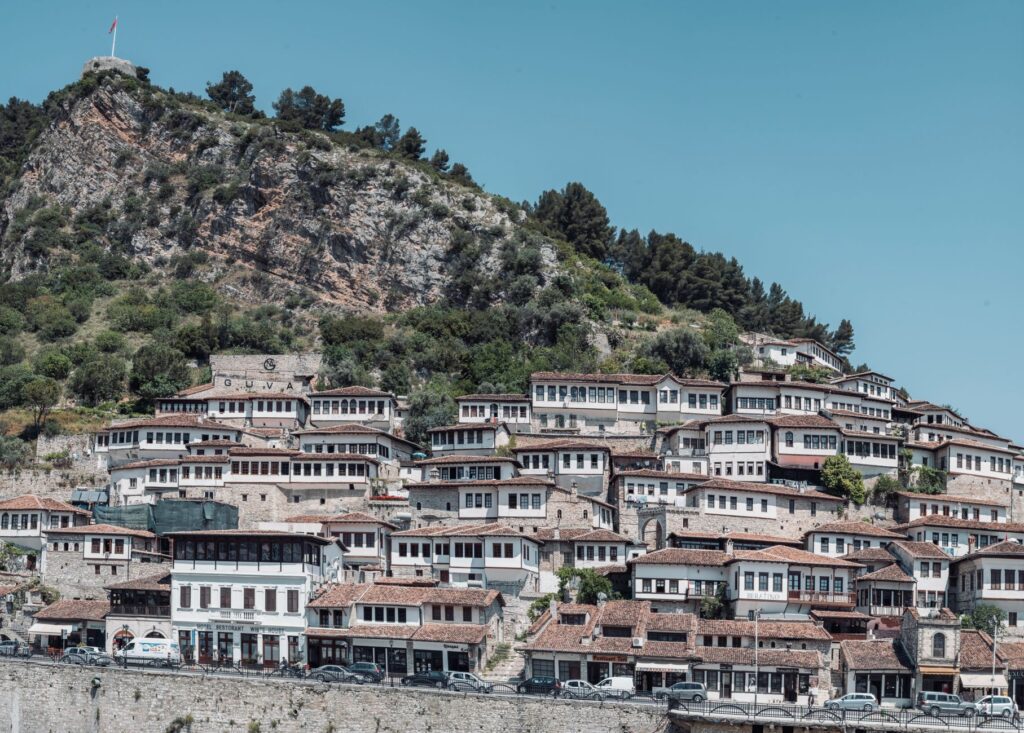 Berat, Albania — View of Berat's traditional Ottoman houses on the hillside, showcasing historical architecture.