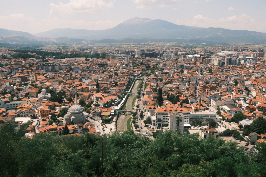 Prizren, Kosovo — Explore the vibrant cityscape of Prizren with a stunning mountain backdrop.