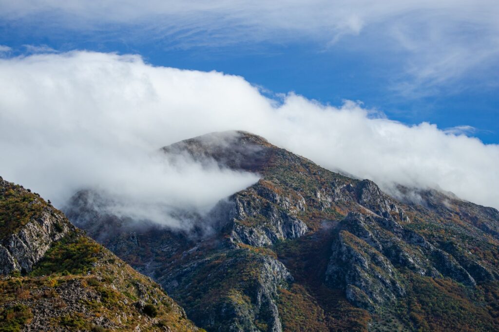 Bar, Montenegro — Stunning view of the rugged mountains in Stari Bar, Montenegro, partially enveloped in clouds.