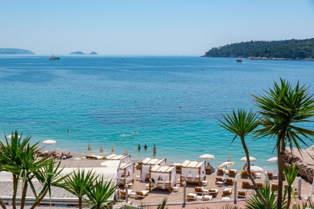 Dubrovnik, Croatia — Stunning beachfront with clear blue waters and loungers in Dubrovnik, Croatia.