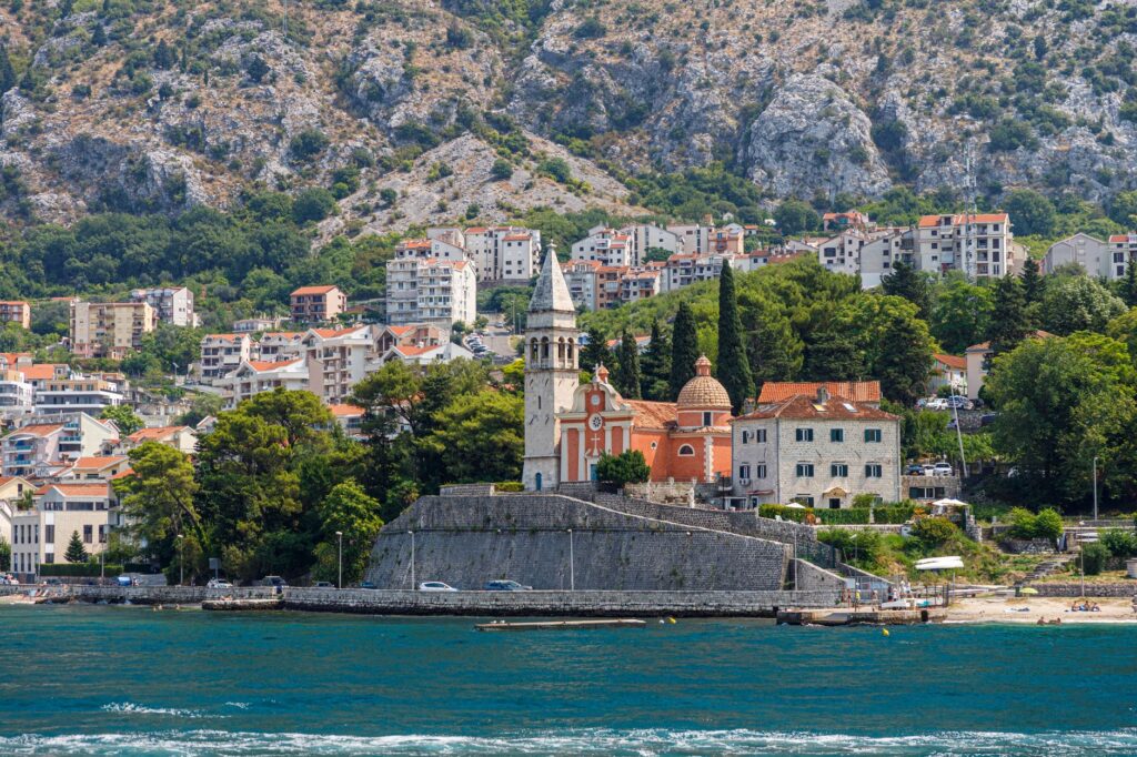 Herceg Novi, Montenegro — Beautiful coastal cityscape of Herceg Novi featuring a historic church by the sea.